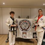 Susie & Will holding student of the year trophies