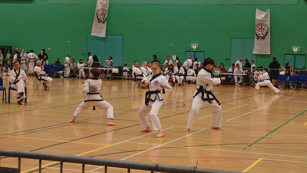 Emily, Will and Jakub performing a team form