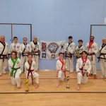 National championships team holding trophies