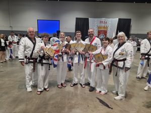 Team members holding trophies and plaques at the World Championships