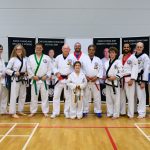 Master Robert Russell with Ely & Witchford students posing as a group at the August 2026 GBTSDA clinic