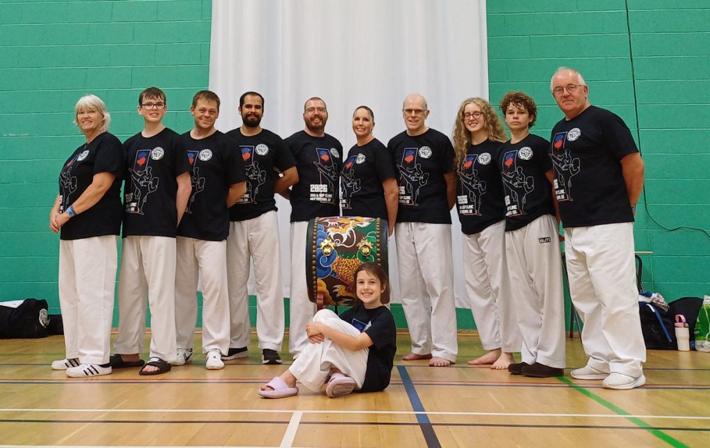 Team group photo in front of the World Tang Soo Do Association banner at the August 2026 GBTSDA clinic